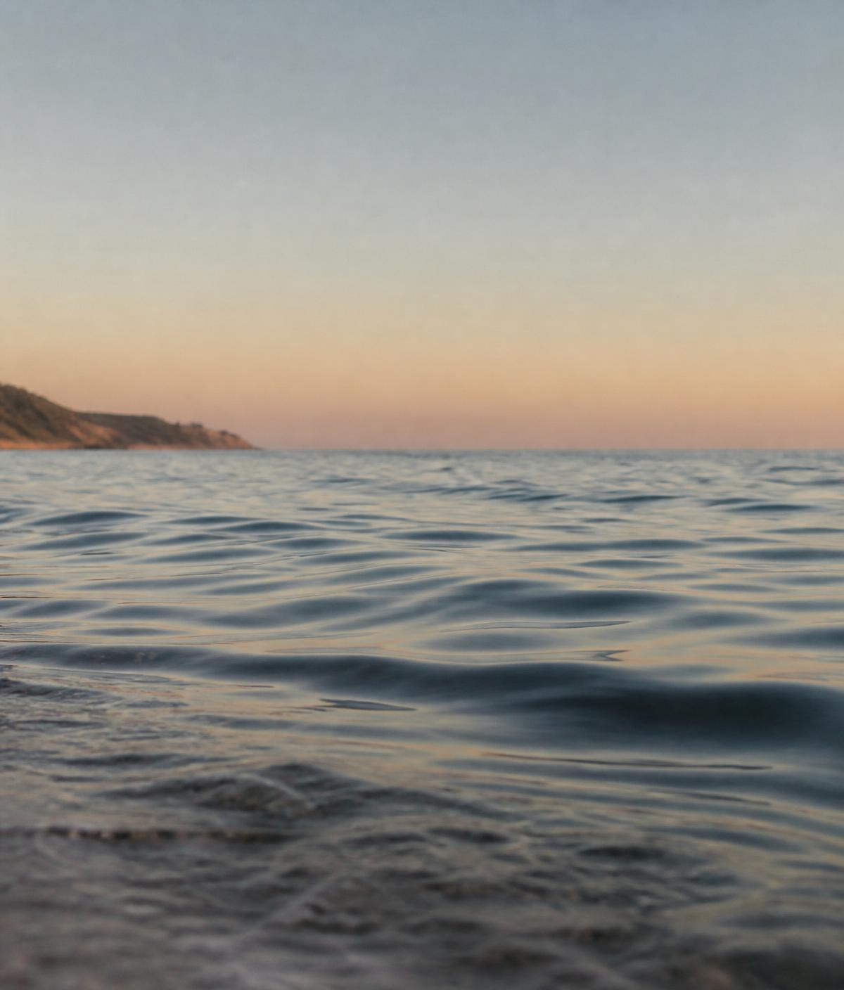 Calm Mediterranean sea at golden hour, a placeholder for a personal sailing or surfing photograph